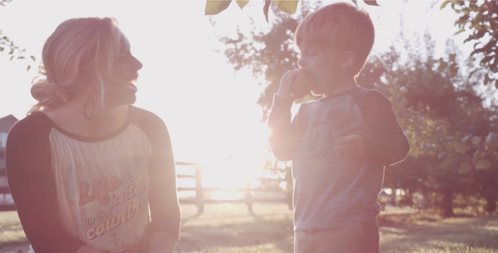 Evans Orchard kid with apple